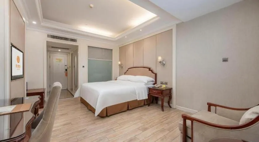 Bed in Vienna Hotel Guangzhou Baiyun College Jinyuan Plaza