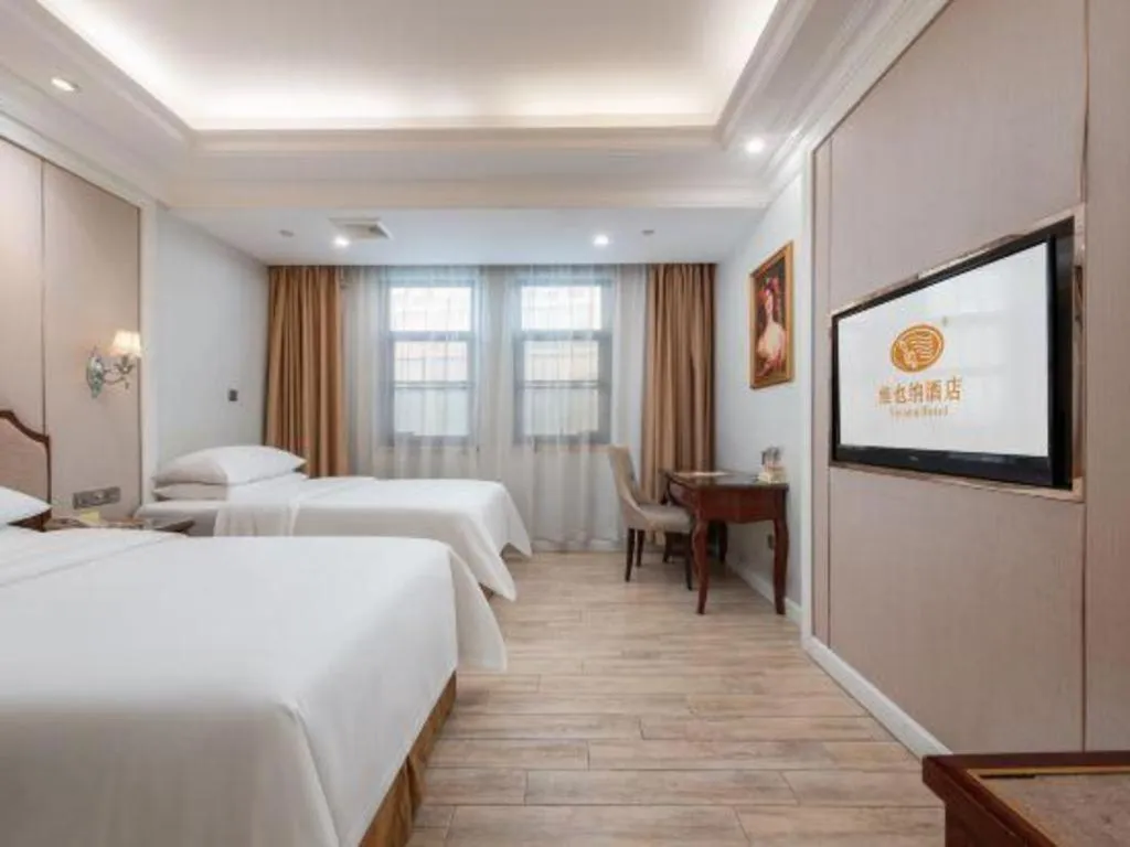 Bed in Vienna Hotel Guangzhou Baiyun College Jinyuan Plaza