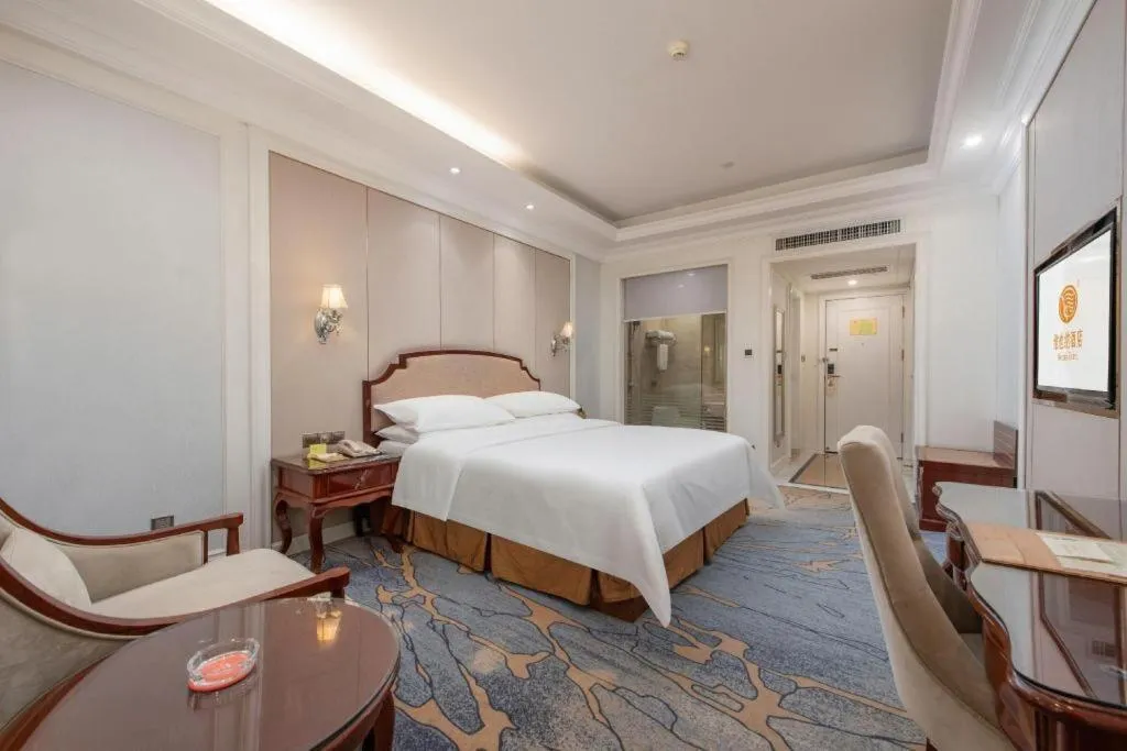Bed in Vienna Hotel Guangzhou Baiyun College Jinyuan Plaza