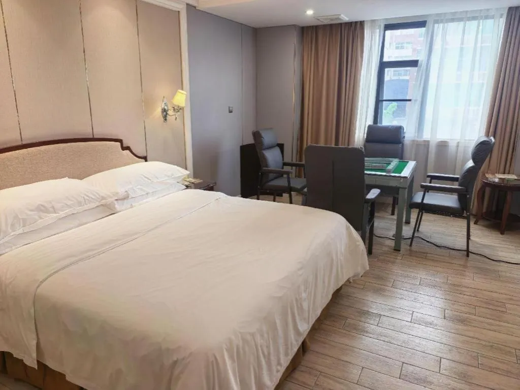 Bed in Vienna Hotel Guangzhou Baiyun College Jinyuan Plaza