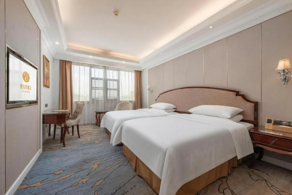 Bed in Vienna Hotel Guangzhou Baiyun College Jinyuan Plaza