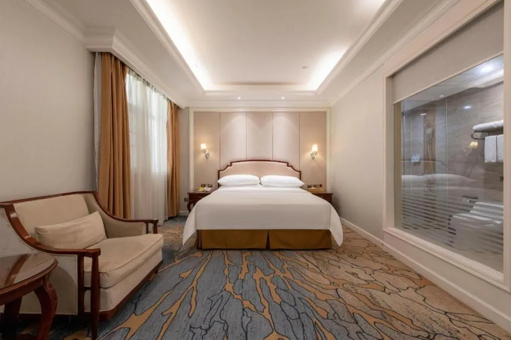 Bed in Vienna Hotel Guangzhou Baiyun College Jinyuan Plaza