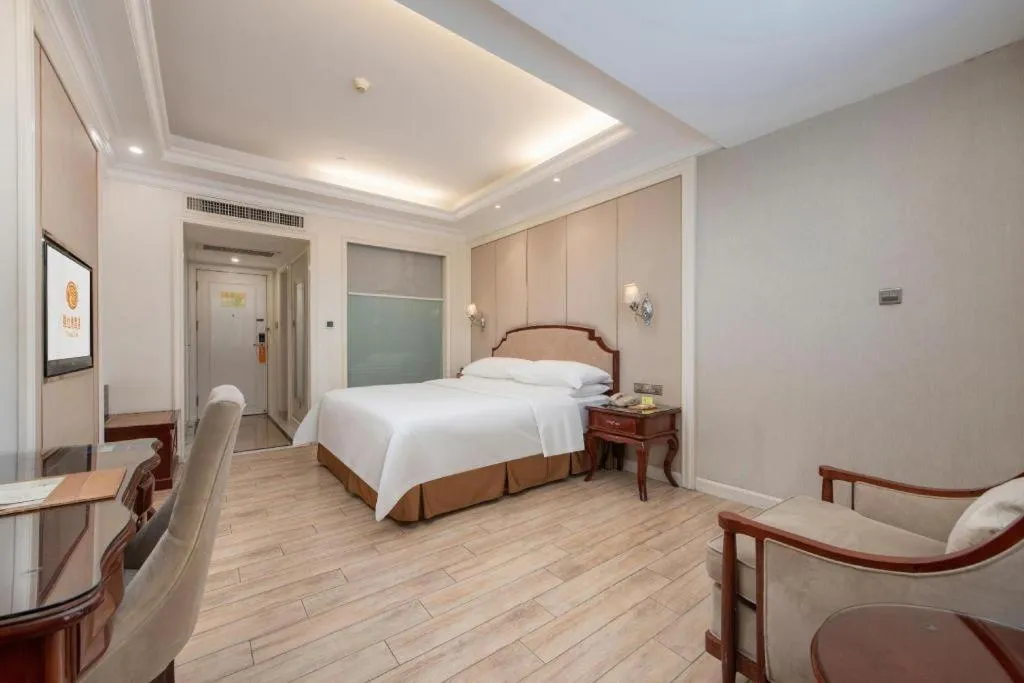 Bed in Vienna Hotel Guangzhou Baiyun College Jinyuan Plaza
