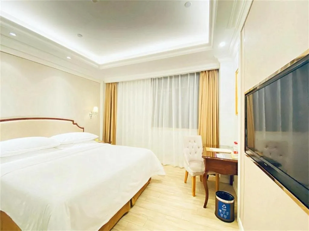 Bed in Vienna Hotel Guangzhou Baiyun College Jinyuan Plaza
