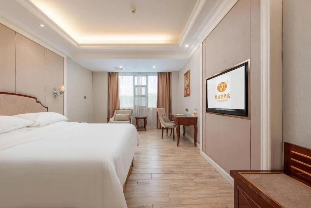 Bed in Vienna Hotel Guangzhou Baiyun College Jinyuan Plaza