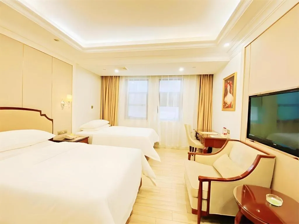 Bed in Vienna Hotel Guangzhou Baiyun College Jinyuan Plaza