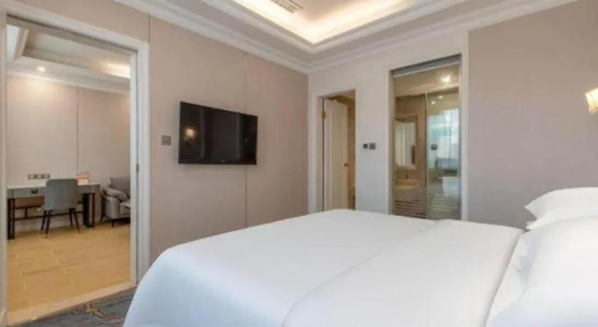 Bed in Vienna Hotel Guangzhou Baiyun College Jinyuan Plaza