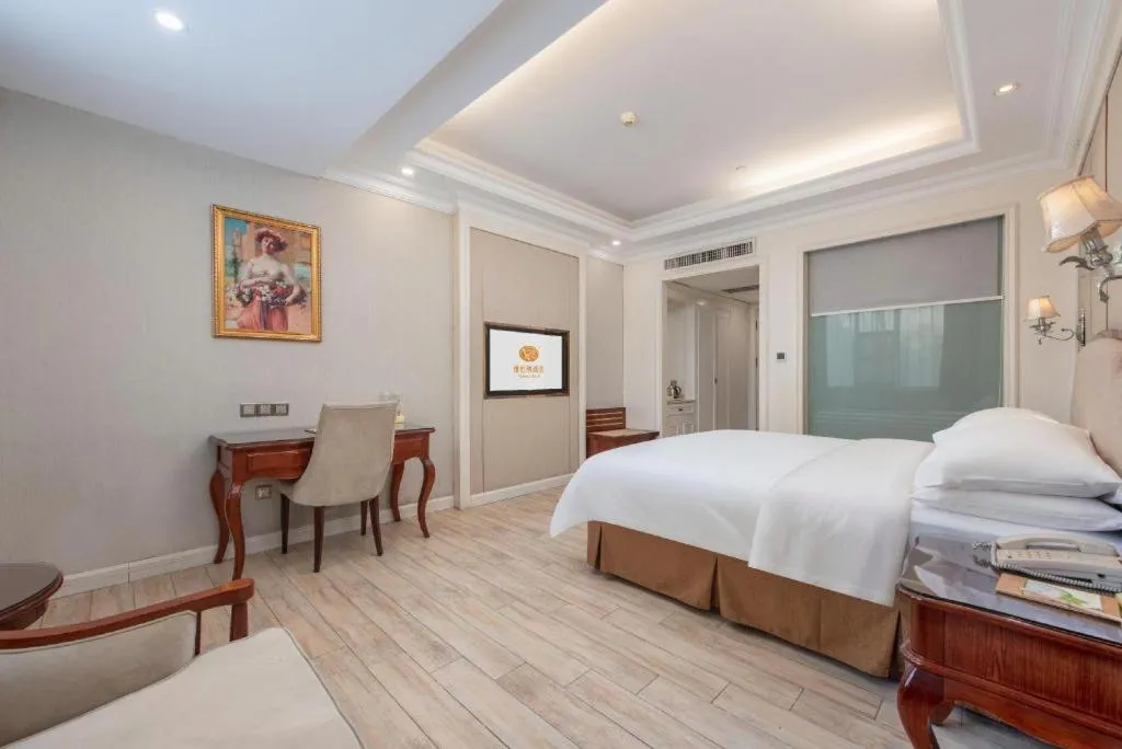 Bed in Vienna Hotel Guangzhou Baiyun College Jinyuan Plaza