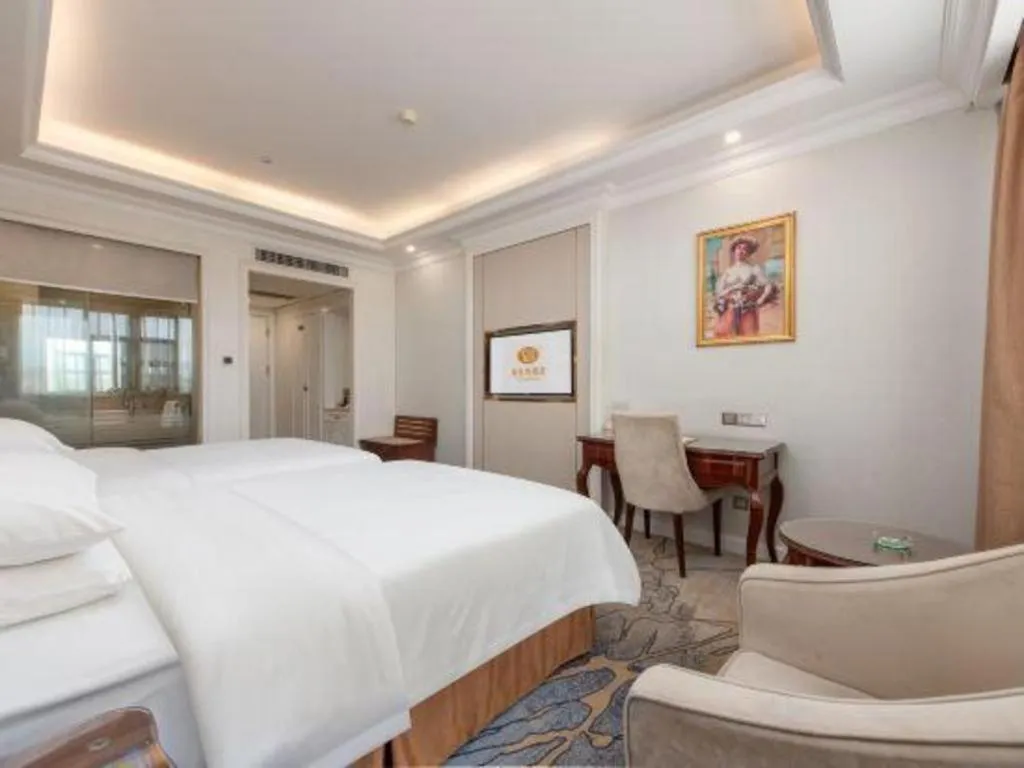 Bed in Vienna Hotel Guangzhou Baiyun College Jinyuan Plaza