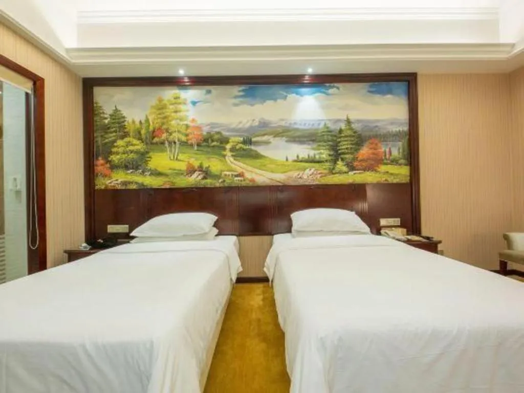 Bed in Vienna Hotel Jiangxi Ji'an Anfu