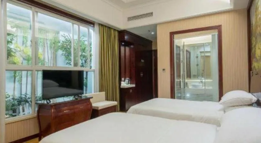 Bed in Vienna Hotel Jiangxi Ji'an Anfu