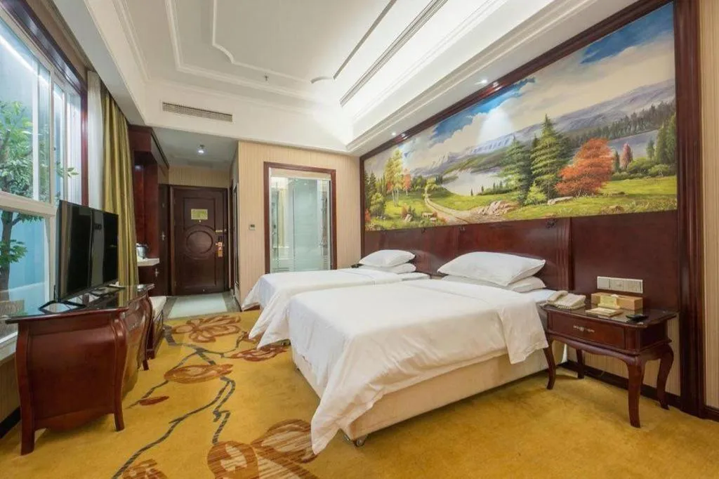 Bed in Vienna Hotel Jiangxi Ji'an Anfu