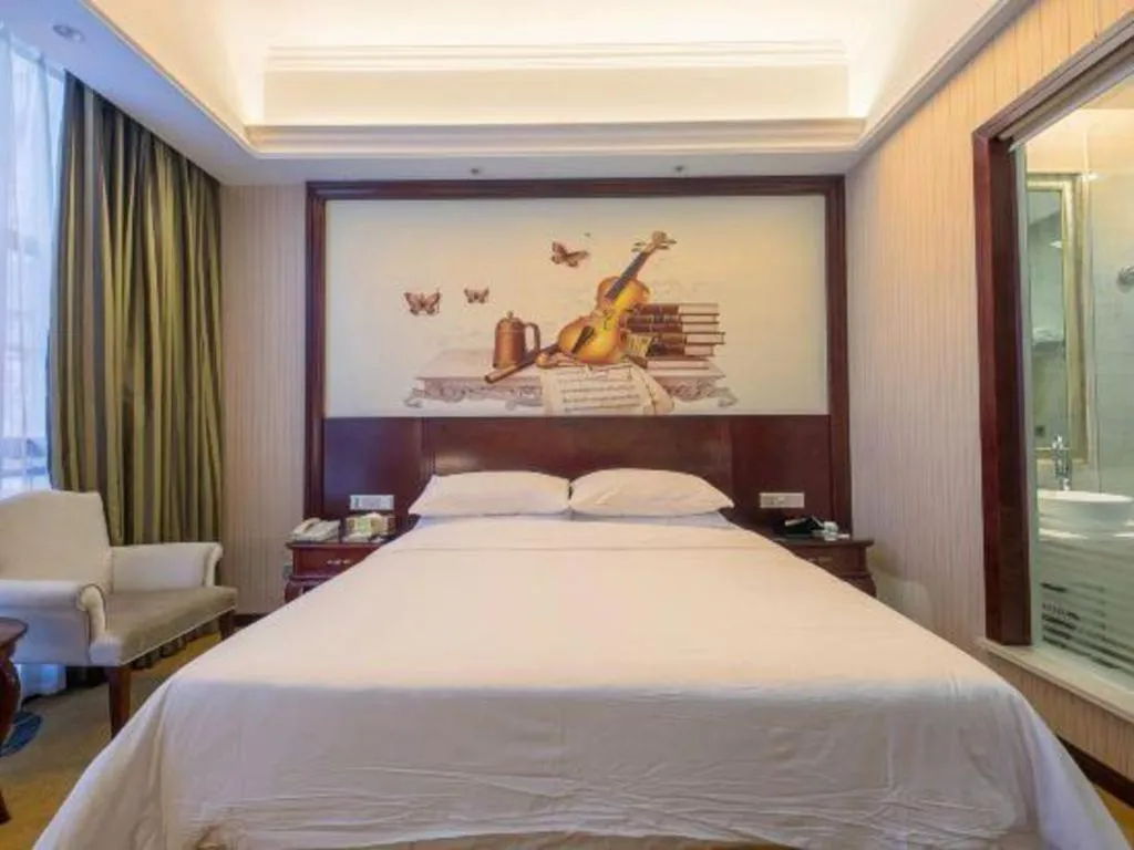 Bed in Vienna Hotel Jiangxi Ji'an Anfu