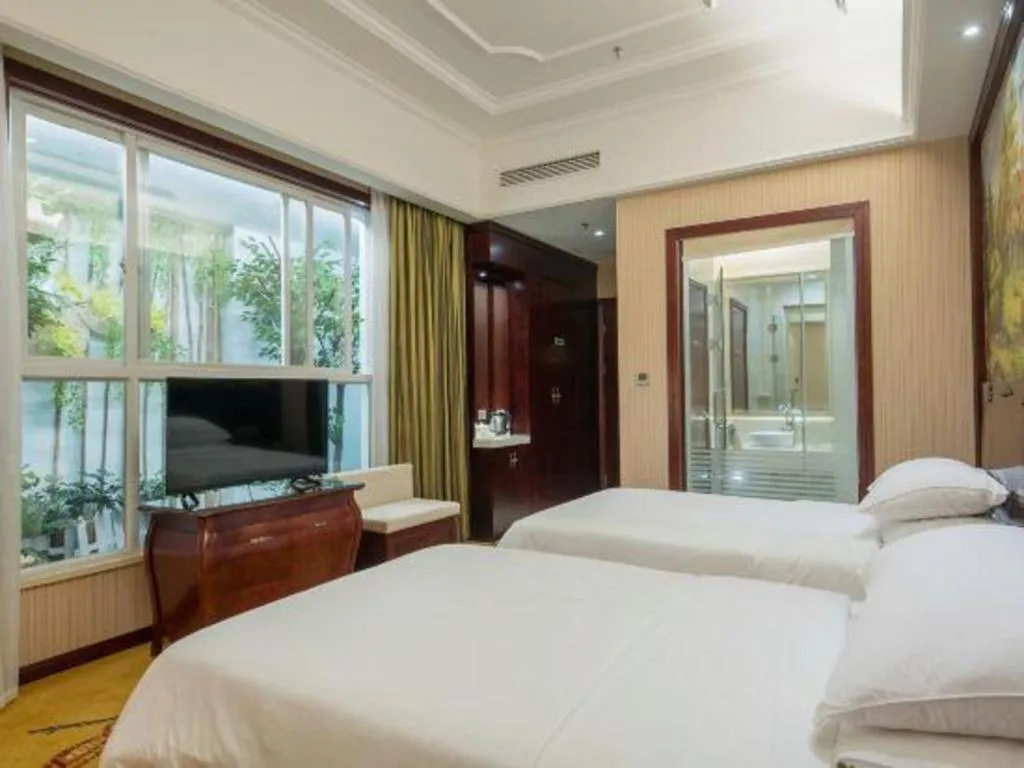 Bed in Vienna Hotel Jiangxi Ji'an Anfu