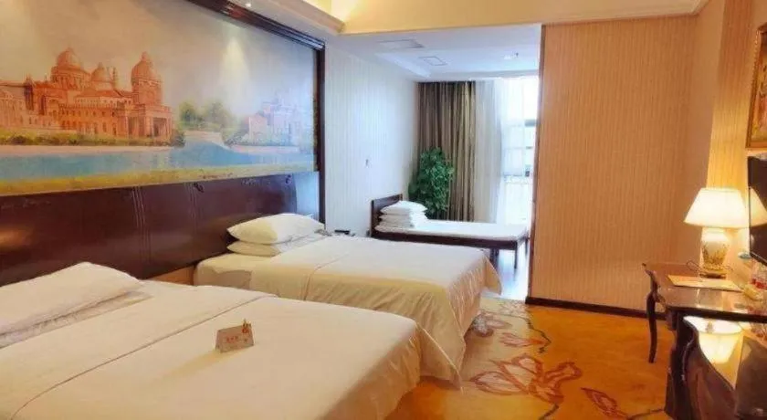 Bed in Vienna Hotel Jiangxi Ji'an Anfu