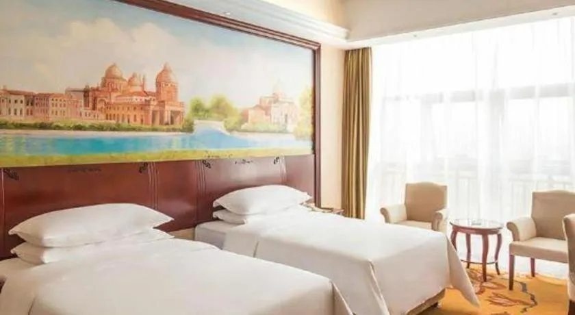 Bed in Vienna Hotel Jiangxi Ji'an Anfu