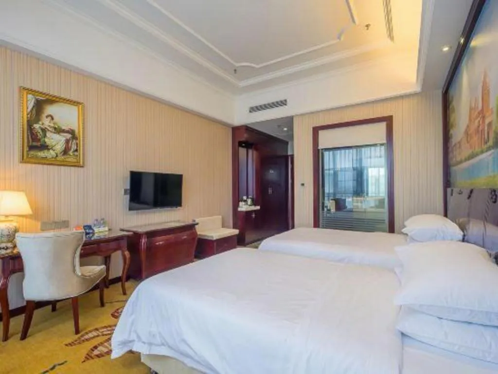 Bed in Vienna Hotel Jiangxi Ji'an Anfu