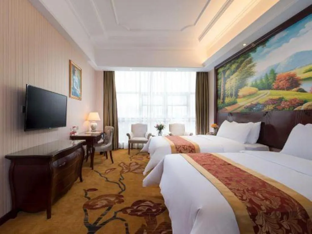 Bed in Vienna Hotel Jiangxi Ji'an Anfu