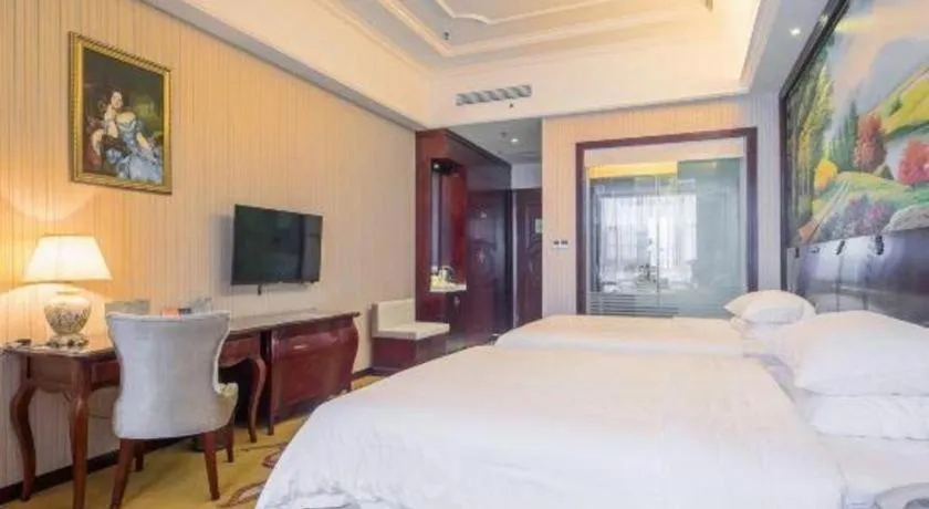 Bed in Vienna Hotel Jiangxi Ji'an Anfu