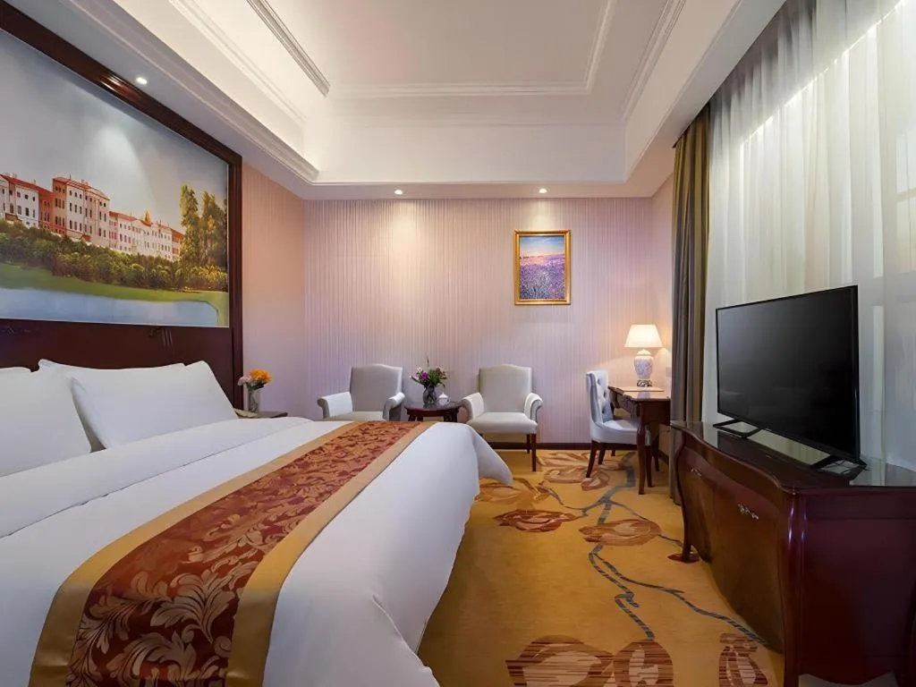 Bed in Vienna Hotel Jiangxi Ji'an Anfu