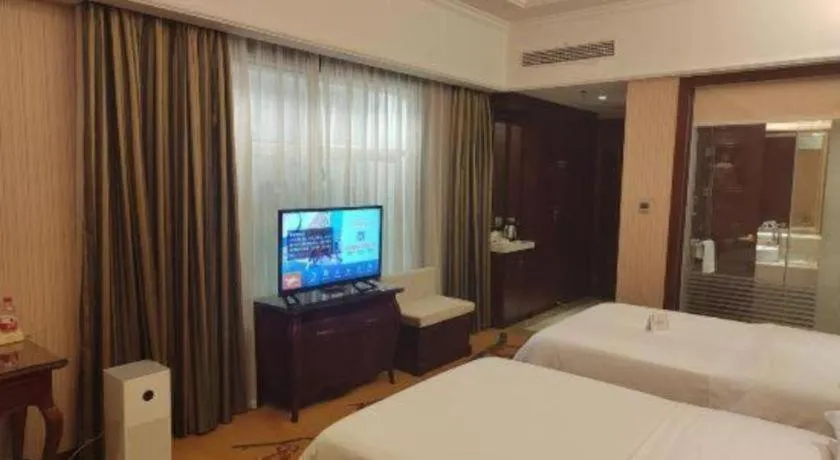 Bed in Vienna Hotel Jiangxi Ji'an Anfu