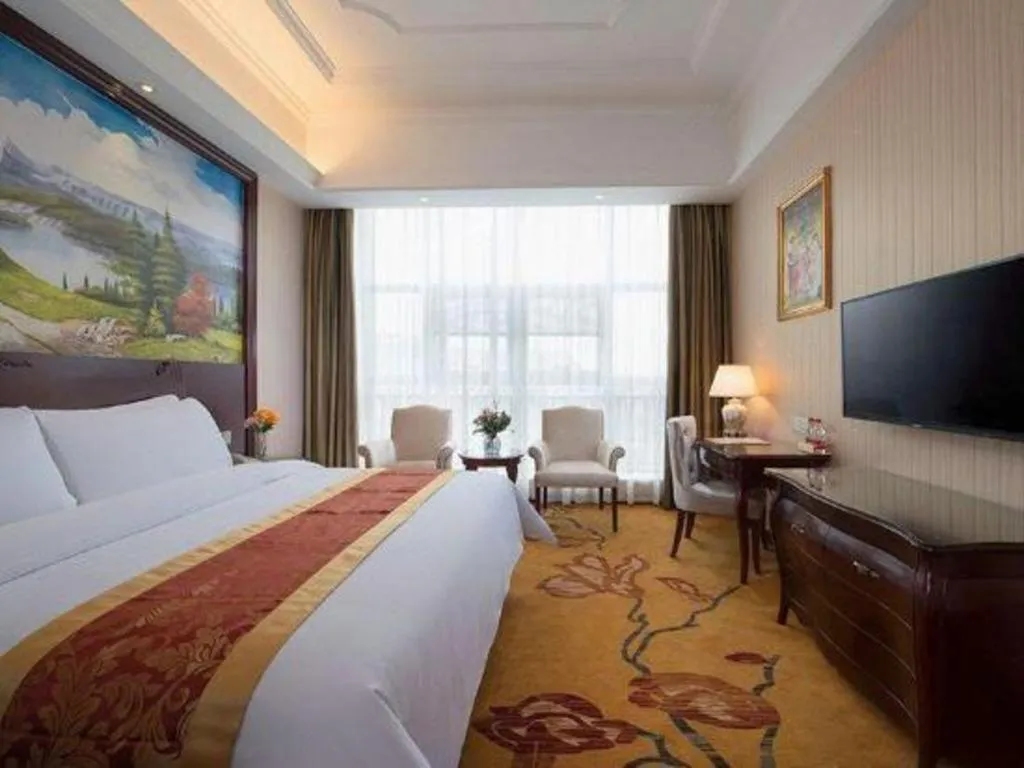 Bed in Vienna Hotel Jiangxi Ji'an Anfu