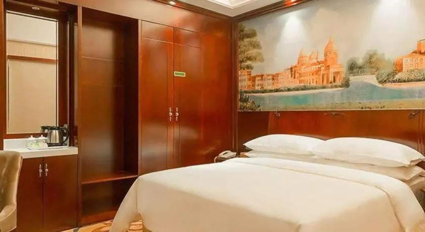 Bed in Vienna Hotel Jiangxi Ji'an Anfu