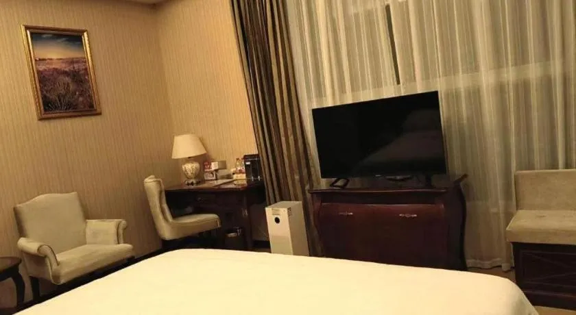 Bed in Vienna Hotel Jiangxi Ji'an Anfu