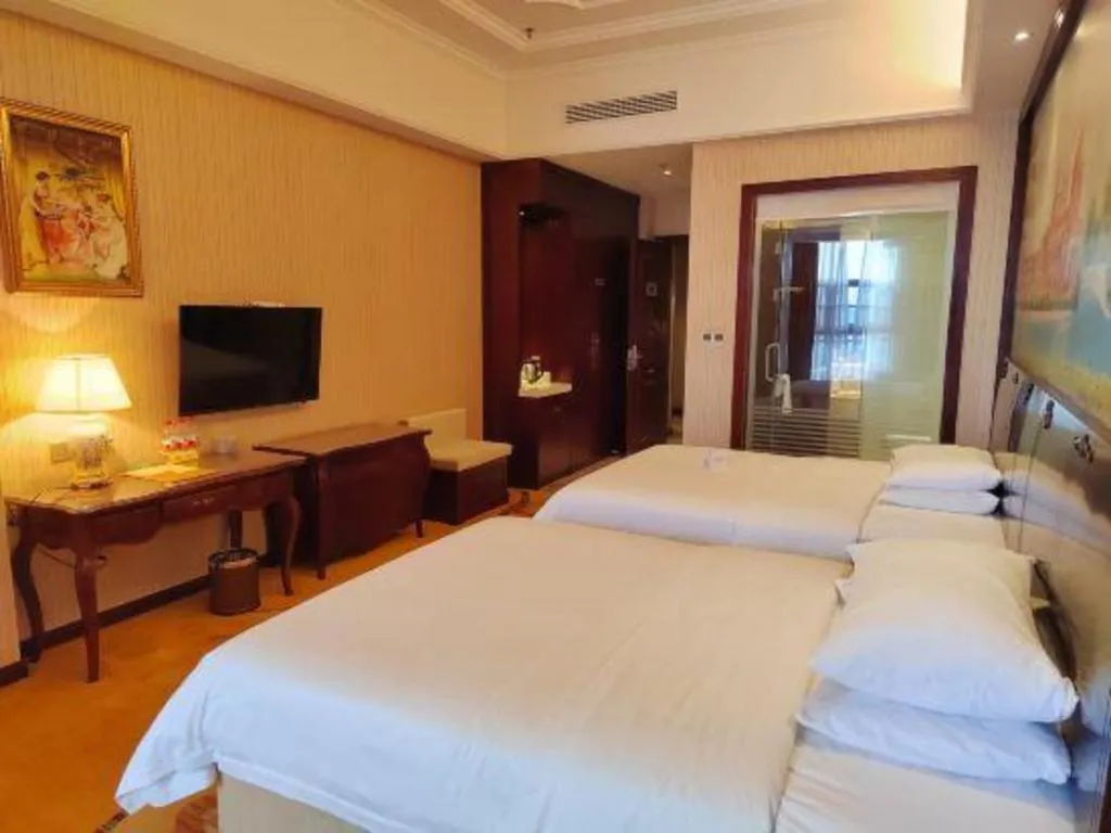 Bed in Vienna Hotel Jiangxi Ji'an Anfu