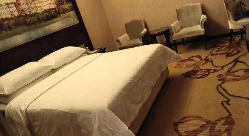 Bed in Vienna Hotel Jiangxi Ji'an Anfu