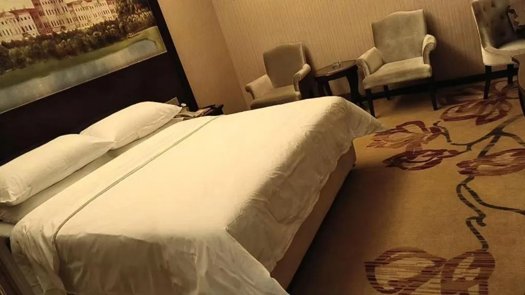 Bed in Vienna Hotel Jiangxi Ji'an Anfu