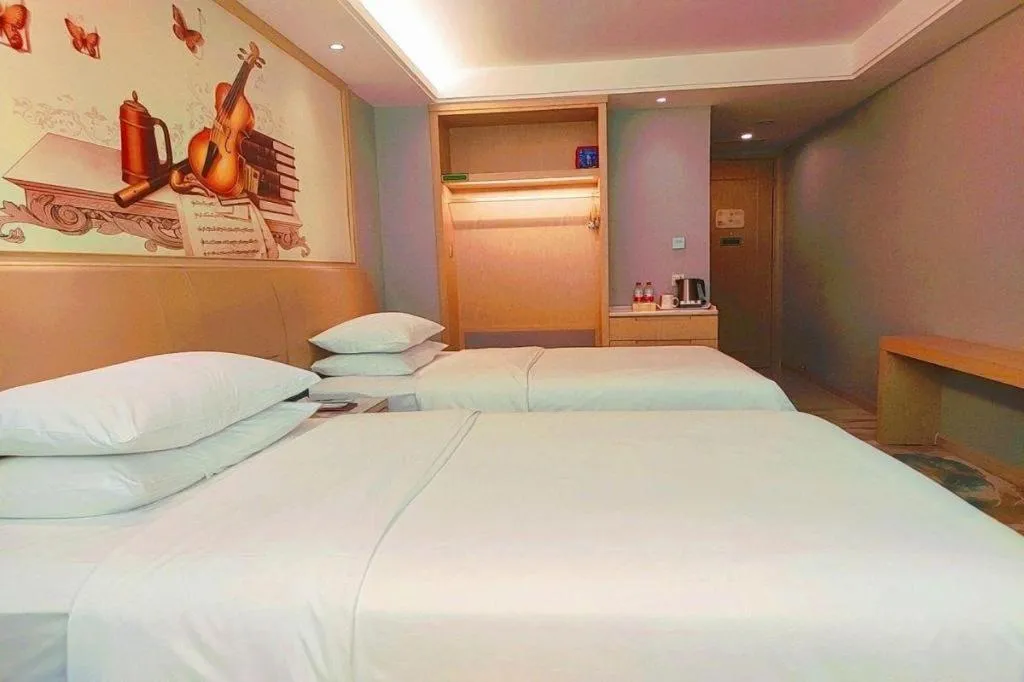 Bed in Vienna Hotel Guangxi Hechi Jinchengjiang Baima Street