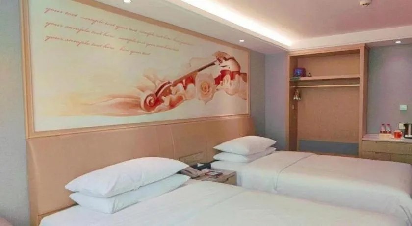 Bed in Vienna Hotel Guangxi Hechi Jinchengjiang Baima Street