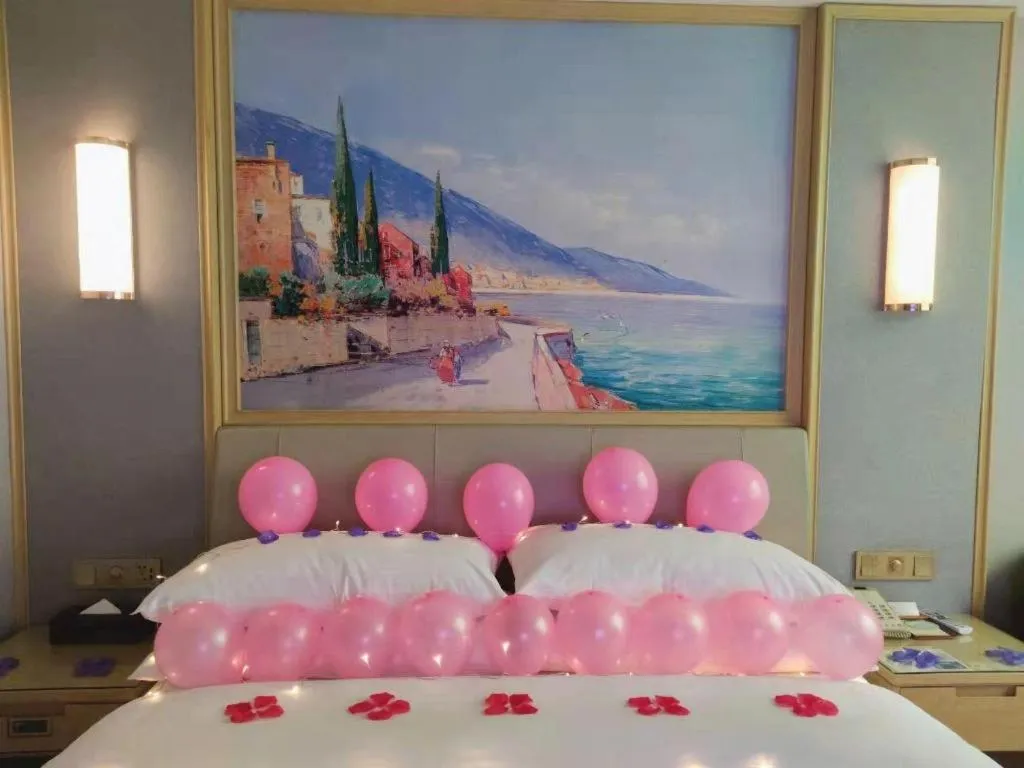 Bed in Vienna Hotel Guangxi Hechi Jinchengjiang Baima Street