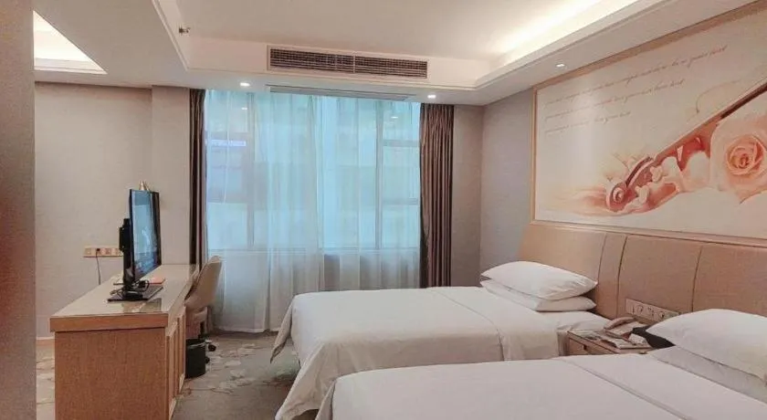 Bed in Vienna Hotel Guangxi Hechi Jinchengjiang Baima Street