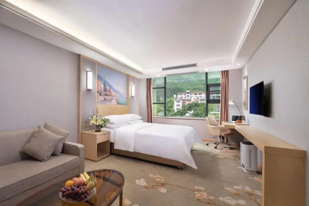 Bed in Vienna Hotel Guangxi Hechi Jinchengjiang Baima Street