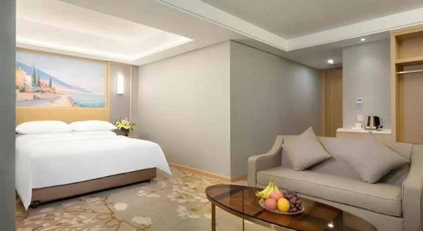 Bed in Vienna Hotel Guangxi Hechi Jinchengjiang Baima Street