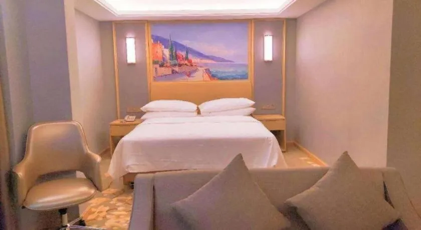 Bed in Vienna Hotel Guangxi Hechi Jinchengjiang Baima Street