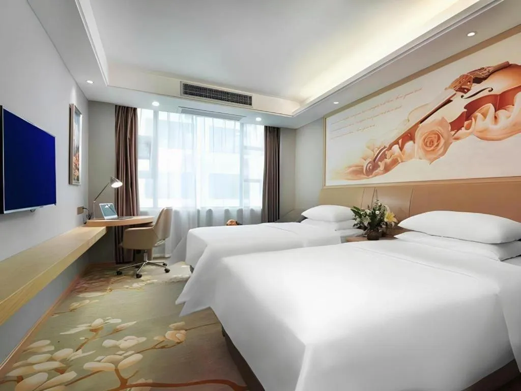 Bed in Vienna Hotel Guangxi Hechi Jinchengjiang Baima Street