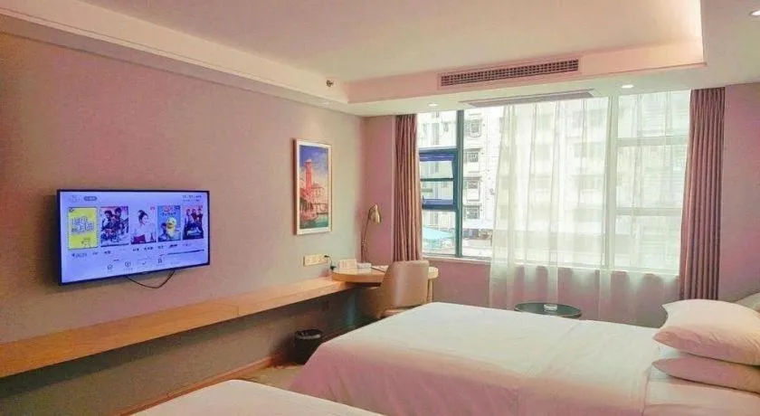 Bed in Vienna Hotel Guangxi Hechi Jinchengjiang Baima Street