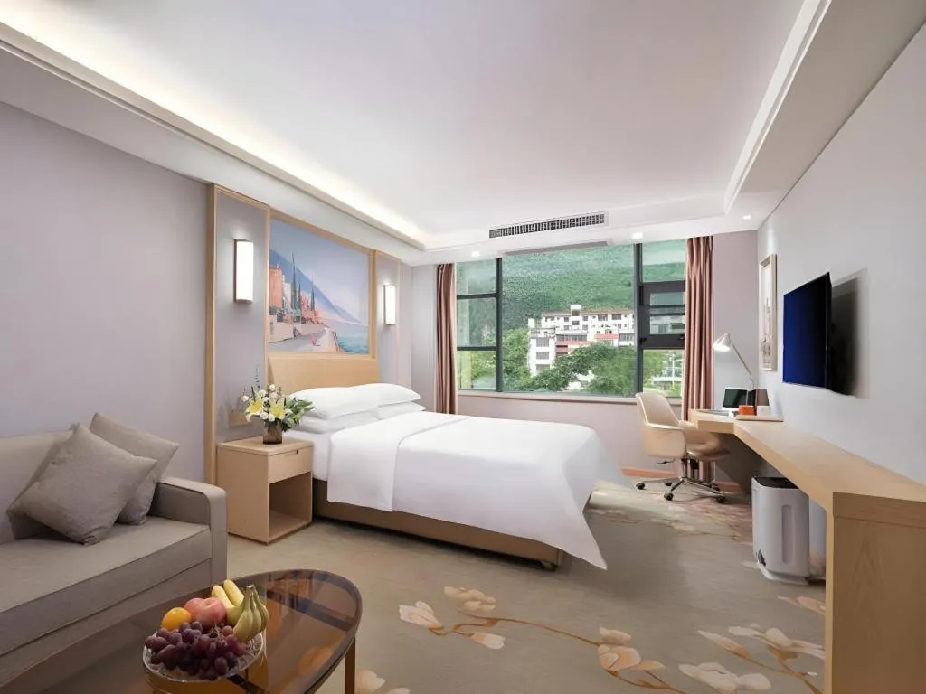 Bed in Vienna Hotel Guangxi Hechi Jinchengjiang Baima Street