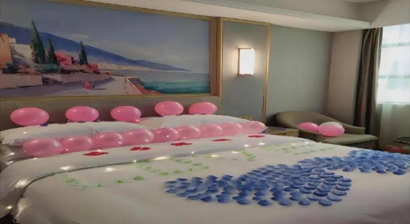 Bed in Vienna Hotel Guangxi Hechi Jinchengjiang Baima Street