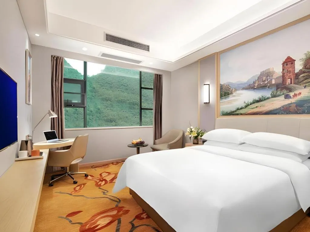 Bed in Vienna Hotel Guangxi Hechi Jinchengjiang Baima Street