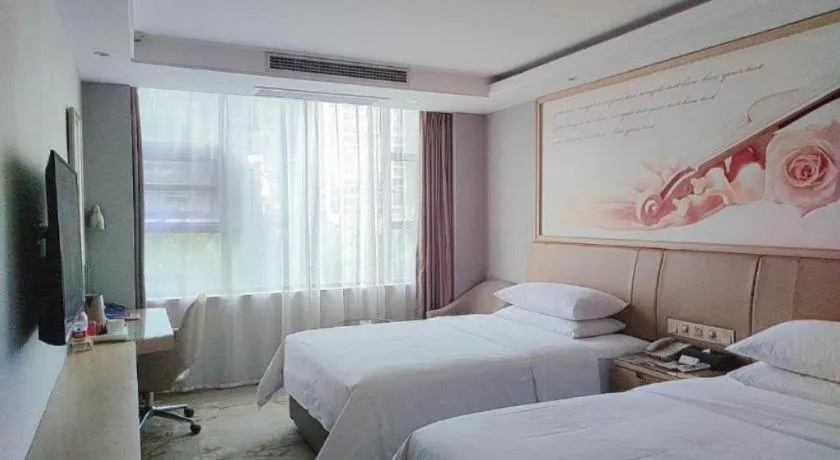 Bed in Vienna Hotel Guangxi Hechi Jinchengjiang Baima Street