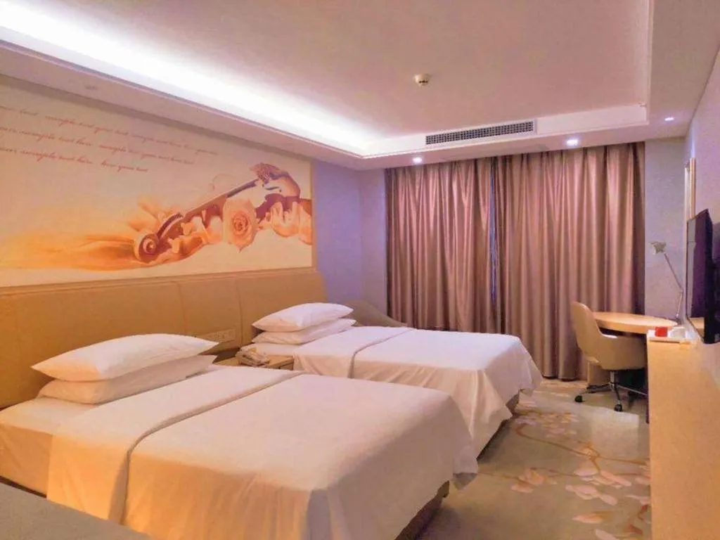 Bed in Vienna Hotel Guangxi Hechi Jinchengjiang Baima Street