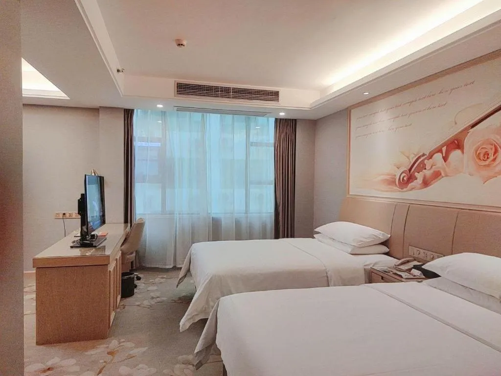 Bed in Vienna Hotel Guangxi Hechi Jinchengjiang Baima Street