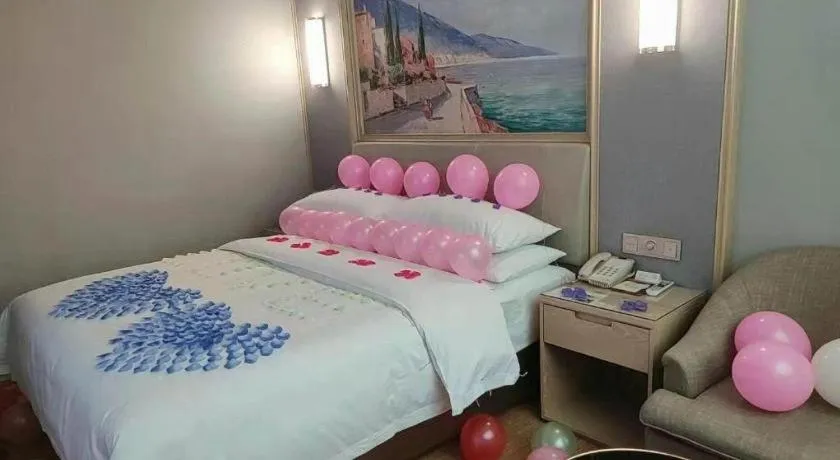 Bed in Vienna Hotel Guangxi Hechi Jinchengjiang Baima Street