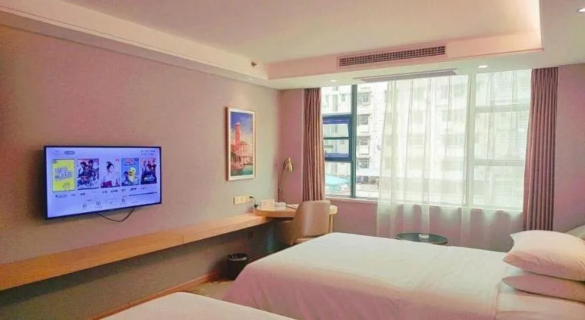 Bed in Vienna Hotel Guangxi Hechi Jinchengjiang Baima Street