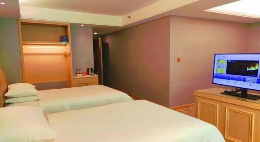 Bed in Vienna Hotel Guangxi Hechi Jinchengjiang Baima Street