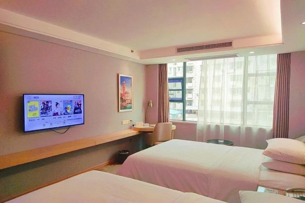 Bed in Vienna Hotel Guangxi Hechi Jinchengjiang Baima Street